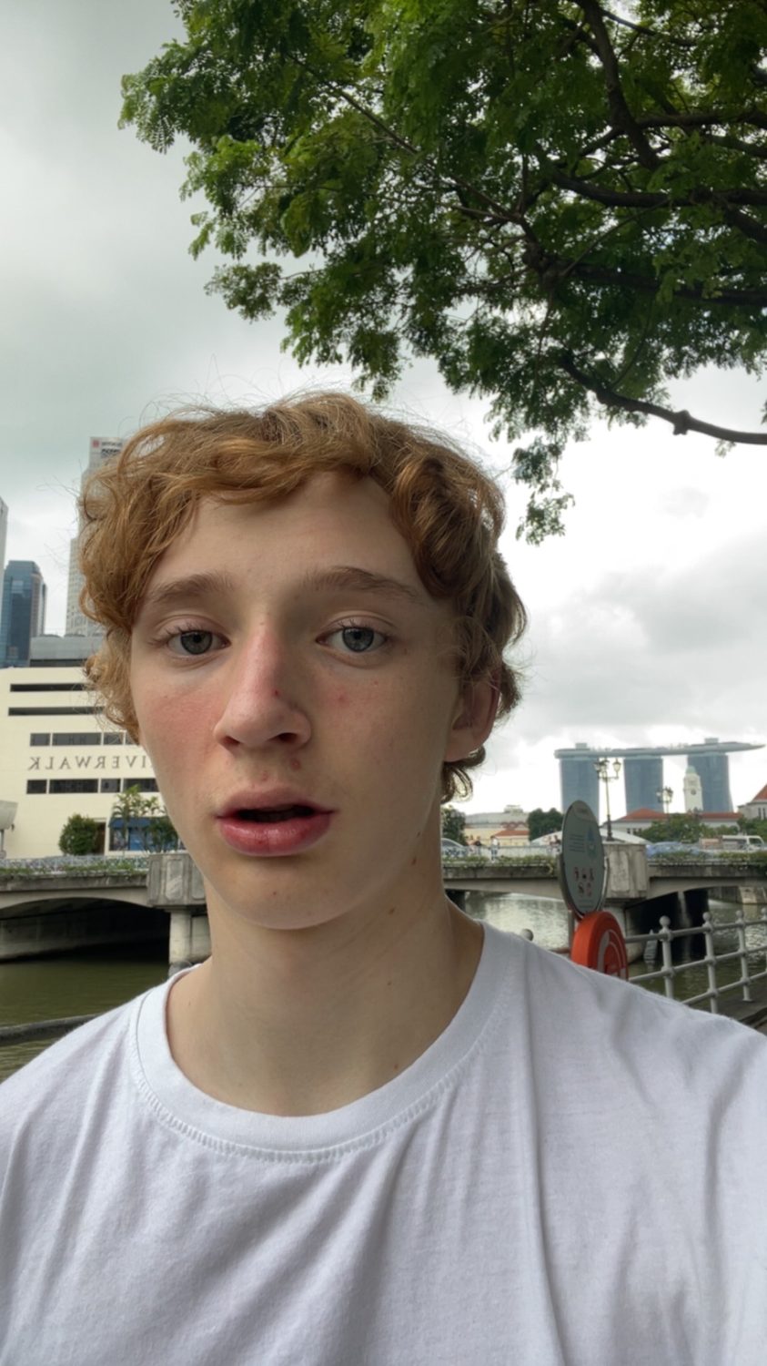 Felix Tinnerholm by the Singapore River with Marina Bay Sands in the background