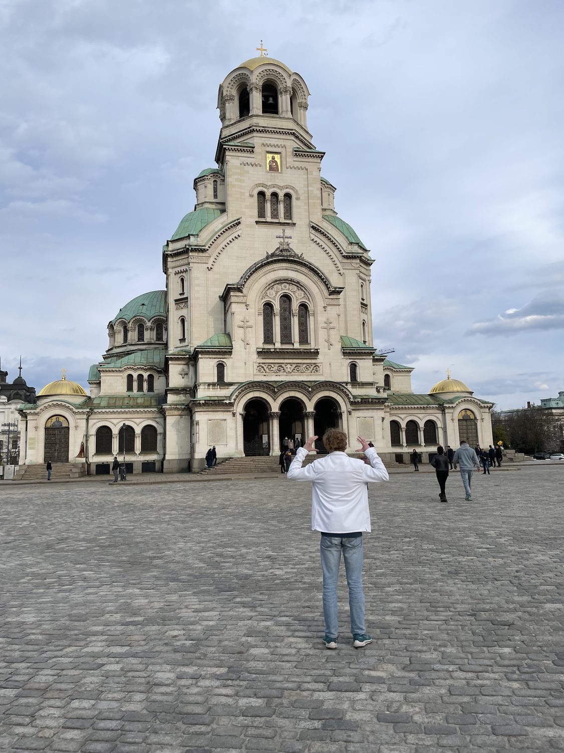 Felix Tinnerholm framing the Alexander Nevsky Cathedral with his hands, Sofia, Bulgaria
