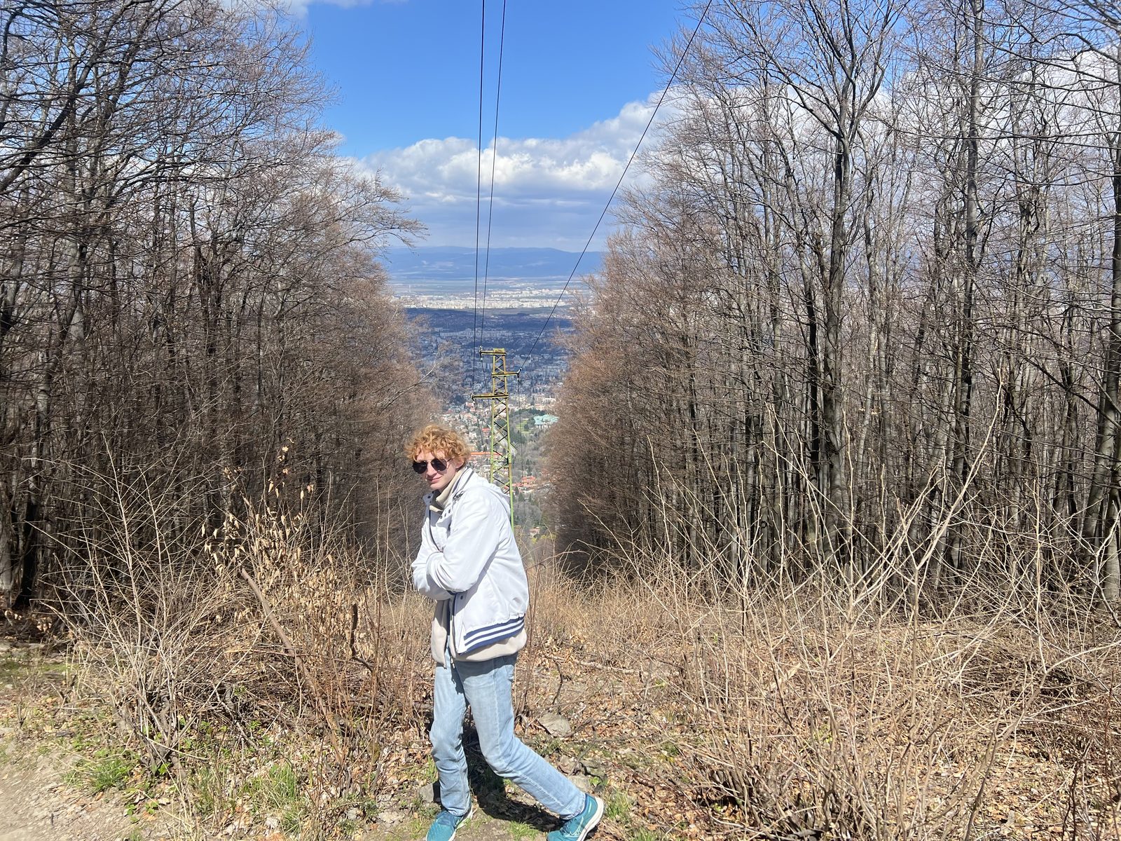 Felix Tinnerholm on a forest path on Vitosha mountain, Sofia visible in the valley below
